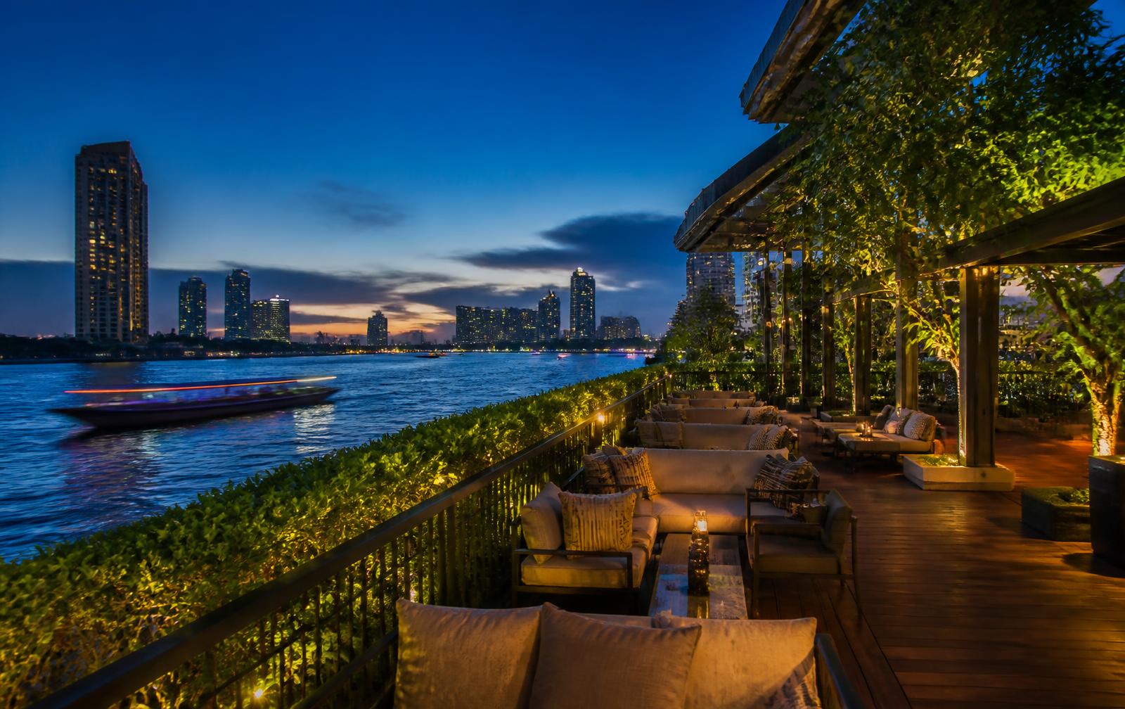 Riverside terrace on the Chao Phraya river at blue hour